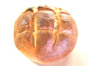 A crusty, flavorful loaf of San Francisco Sourdough Bread made with Genuine San Francisco Sourdough Starter.